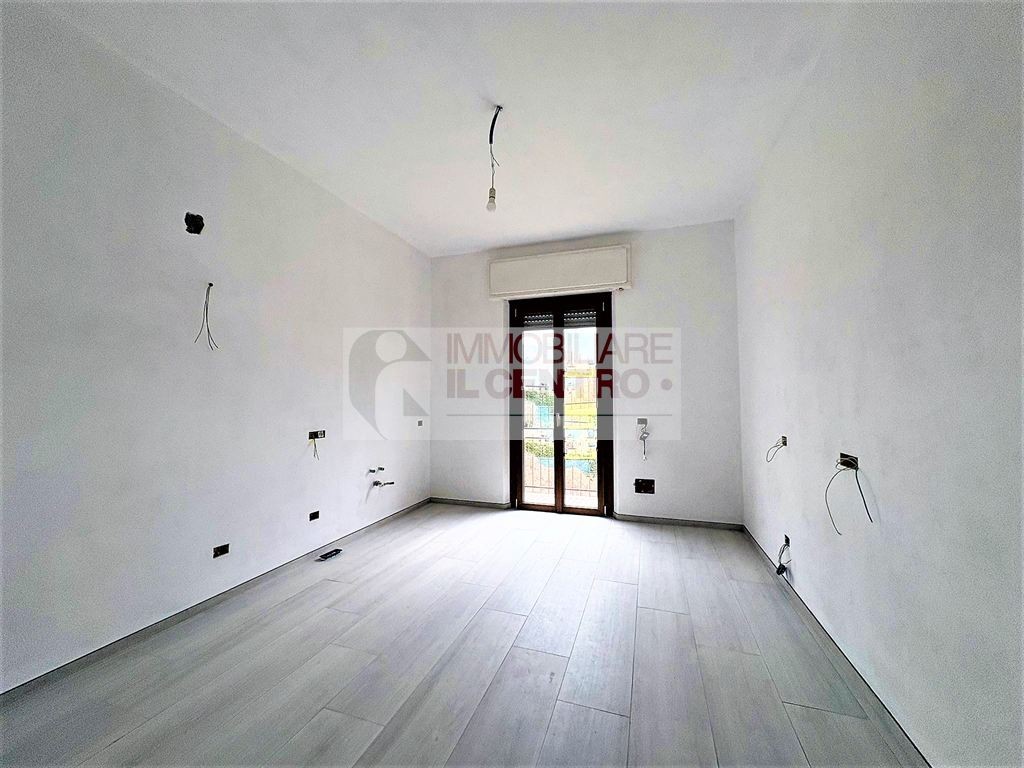 Appartamento di casa bifamigliare con giardino e cantina.